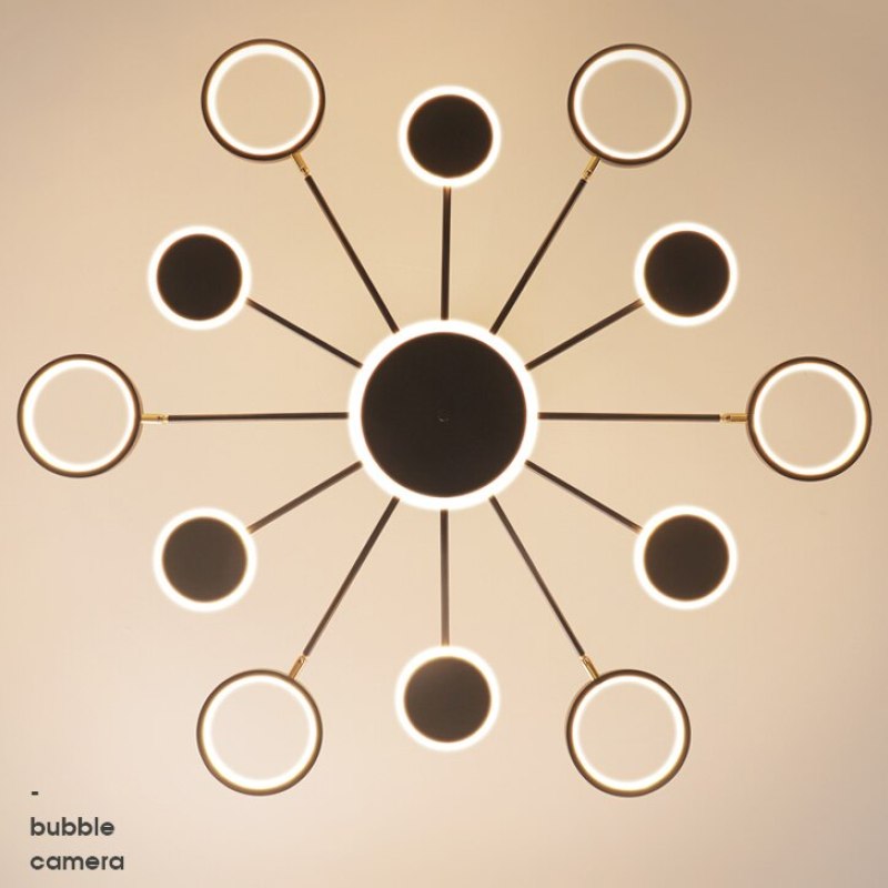 Bottom-facing twelve-arm starburst with alternating illuminated ring and disc heads around a central disc