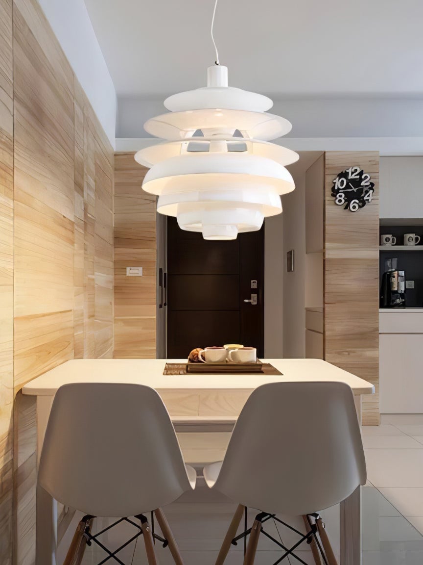 Snowball pendant above a white dining table and chairs