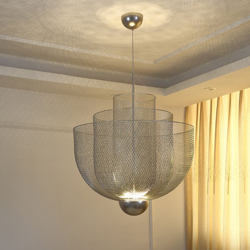 Silver layered mesh pendant lit below ceiling canopy