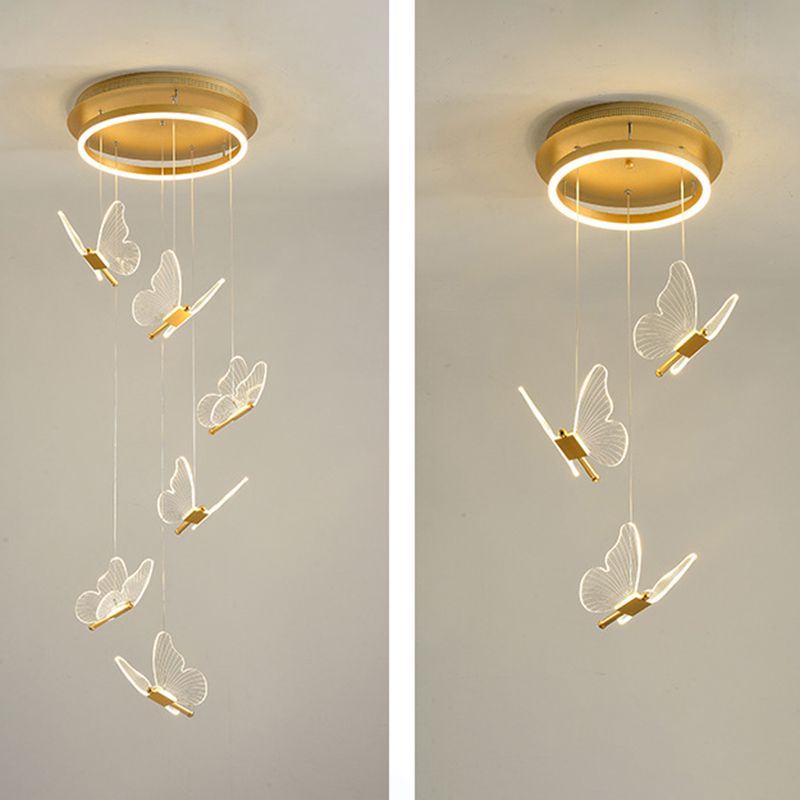 Side-by-side butterfly pendants with six and three hanging lights