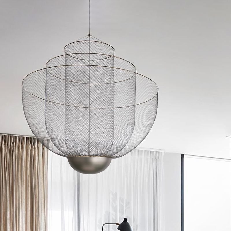 Silver mesh pendant in room above curtains