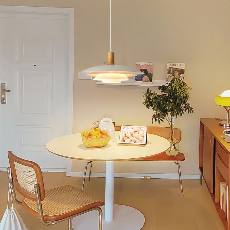A-Wood layered white pendant over small dining table