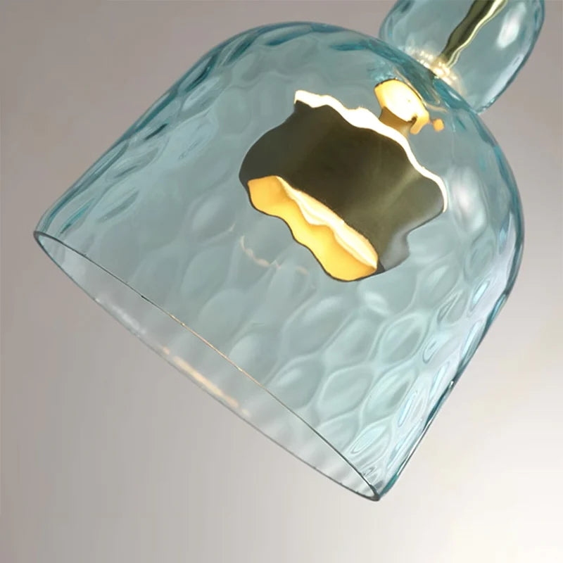 Textured pale blue glass cup seen from below