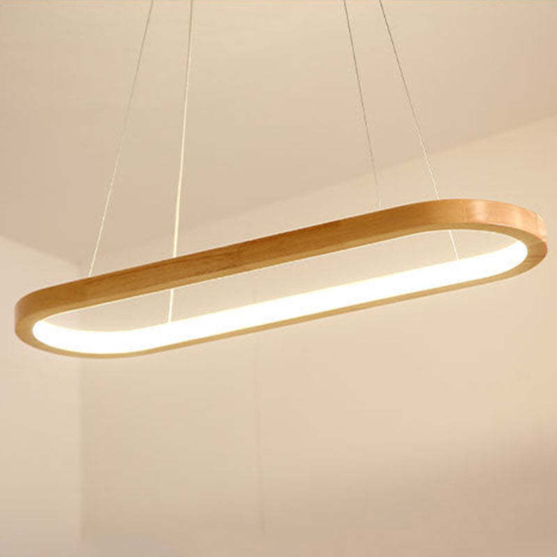 Warm-looking oval wood pendant against pale wall