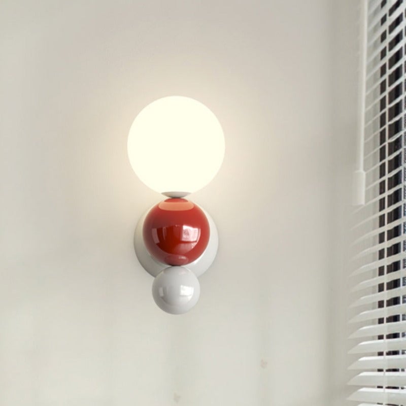 Red-option Valentina globe wall light beside window blinds