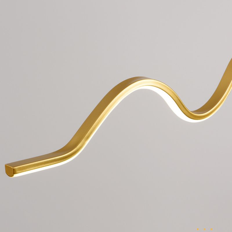 Close detail of gold-coloured curved bar and glowing light strip
