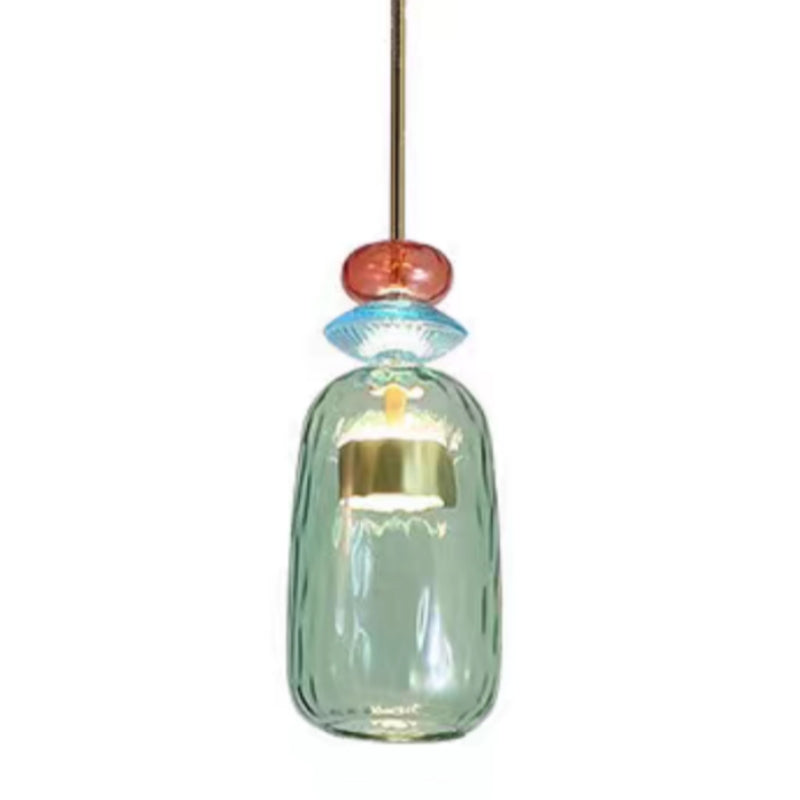 Tall pale aqua glass cylinder below coloured beads