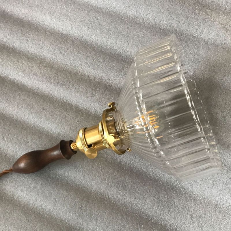 Cairns ribbed glass shade and upper fitting resting on textured fabric