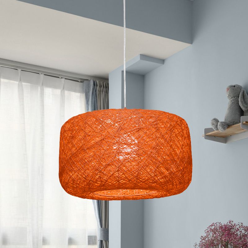 Orange woven rattan drum pendant in grey blue room