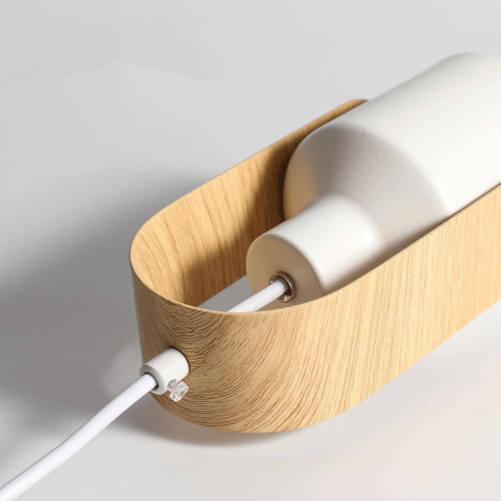 Close view of white cylinder and grain-look curved support