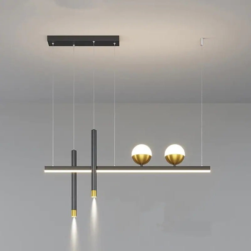 Front view of Madina linear pendant with two downward cylinders and two globes.