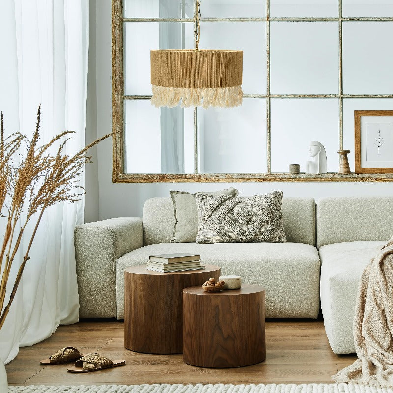Wide rope drum pendant above neutral sofa and tables