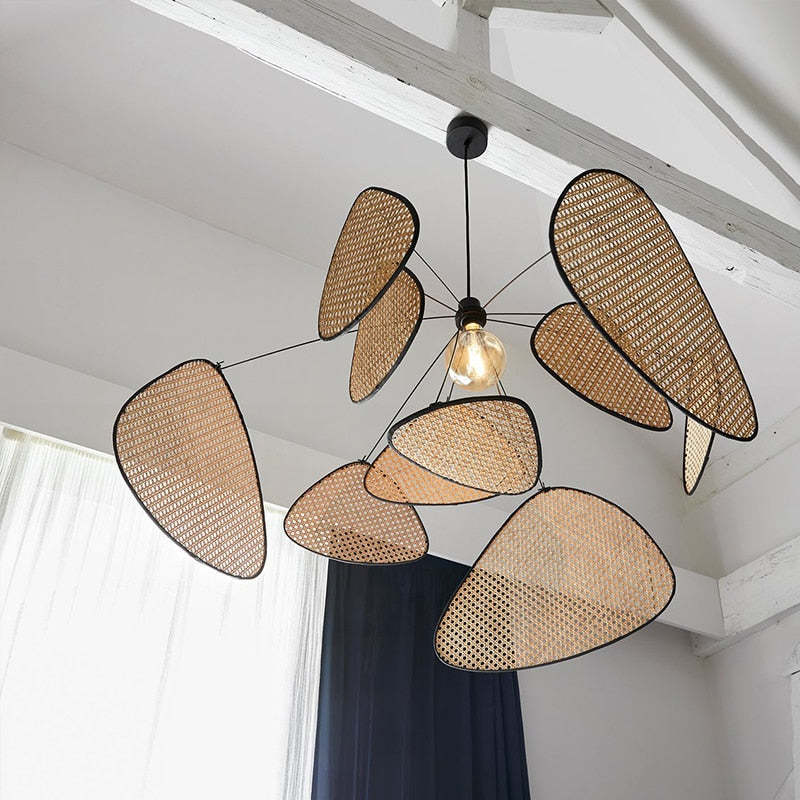 Rattan leaf pendant viewed from below beneath ceiling beams