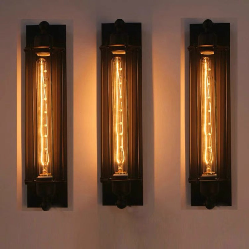 Three Orr black wall lights pictured in a vertical arrangement