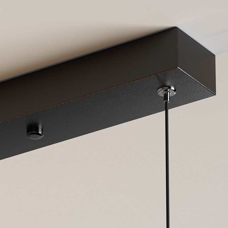 Close-up of the black Louise ceiling canopy and the attachment for a suspension cord.