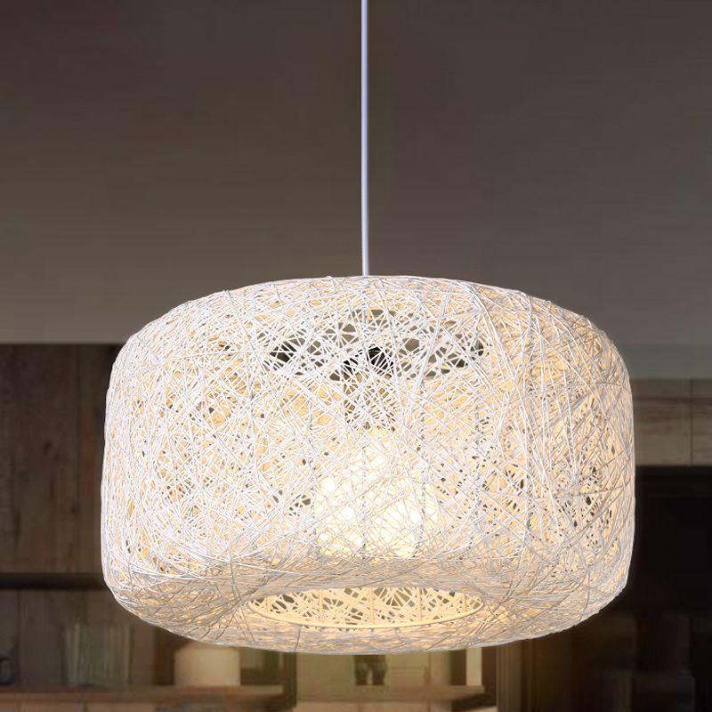White woven rattan drum pendant in room