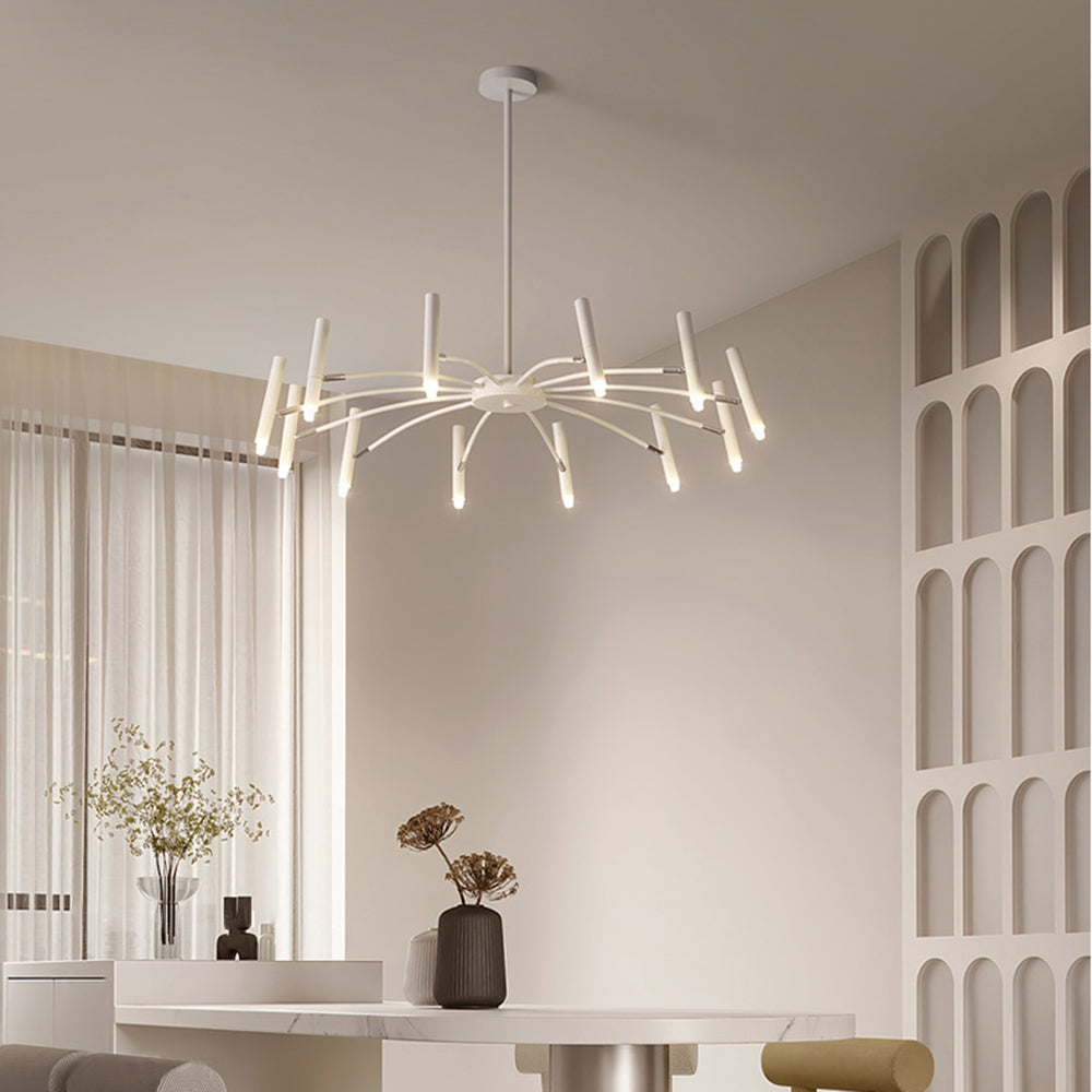 White Evette 12-head chandelier above a pale dining table with vases and arched wall niches