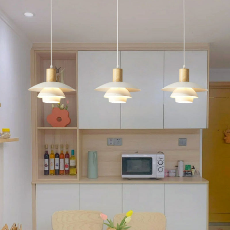 Three B white layered pendants in kitchen