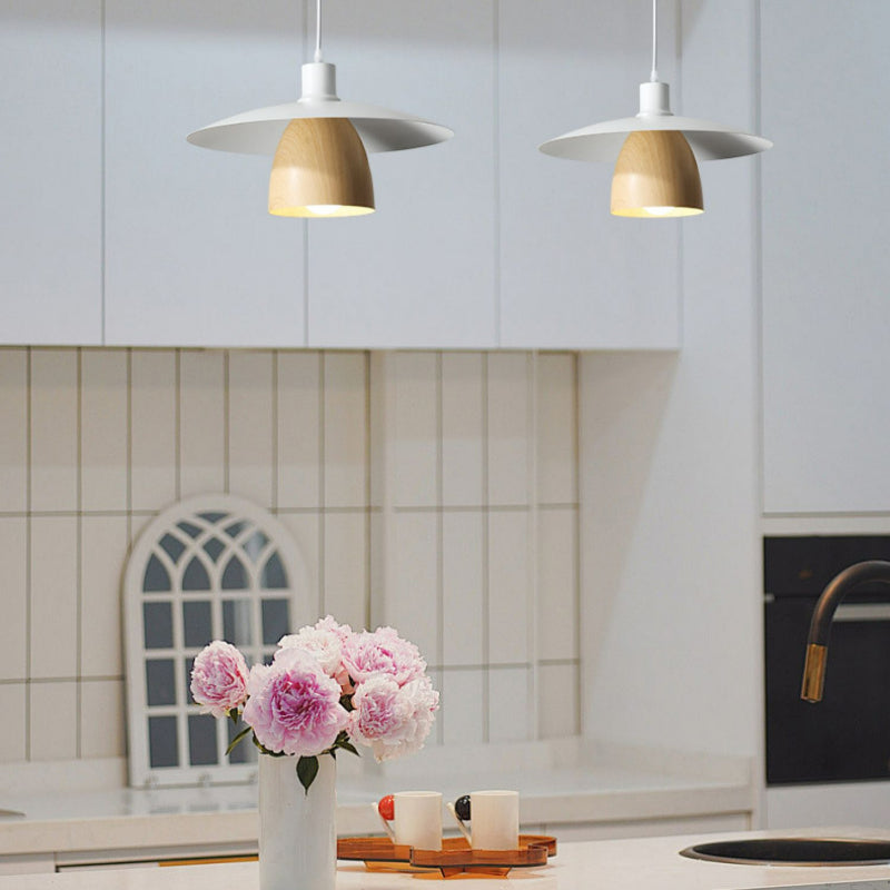 Two D white disc and wood-look cone pendants above counter