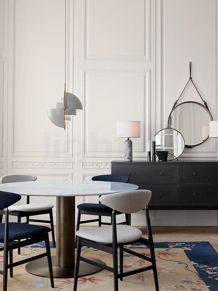 White pendant with separated shade halves in a dining room
