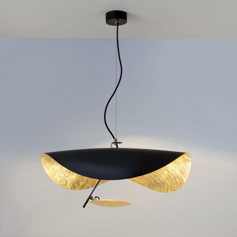 Renée curved black shade and gold-toned lower disc against a grey background