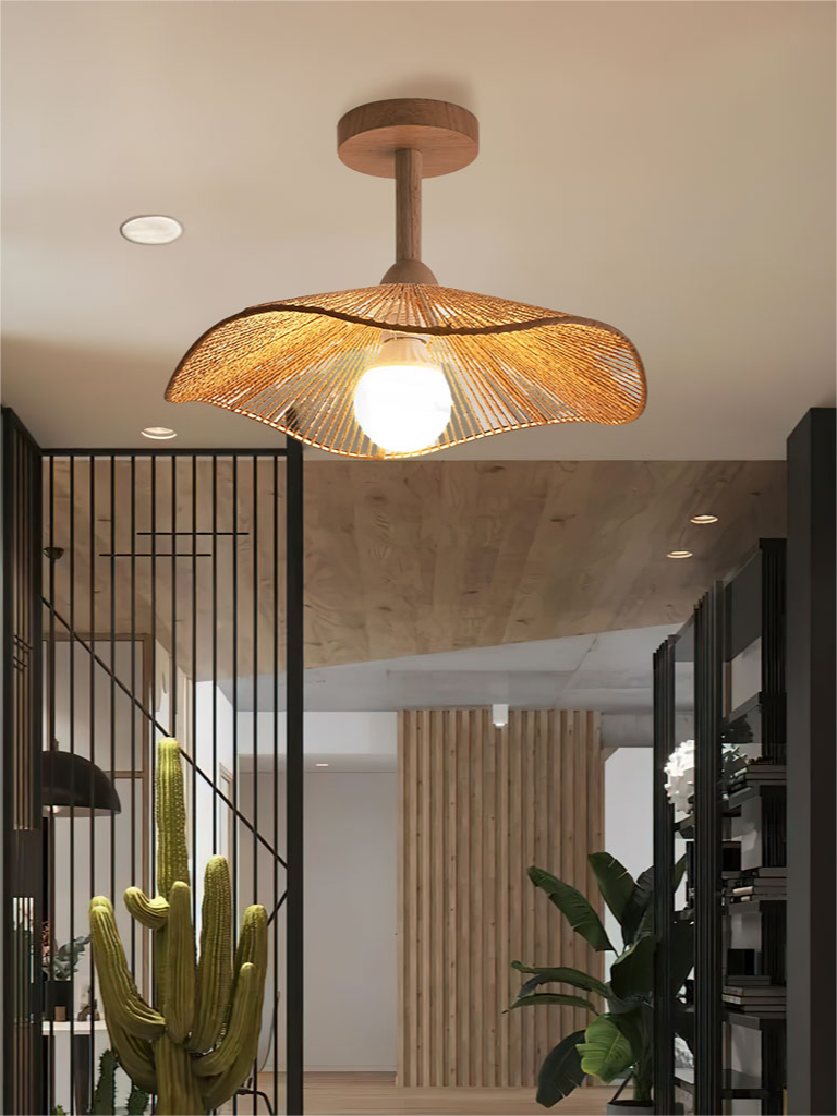Hazel ceiling lamp on a short stem in an interior with a staircase and tall plant.
