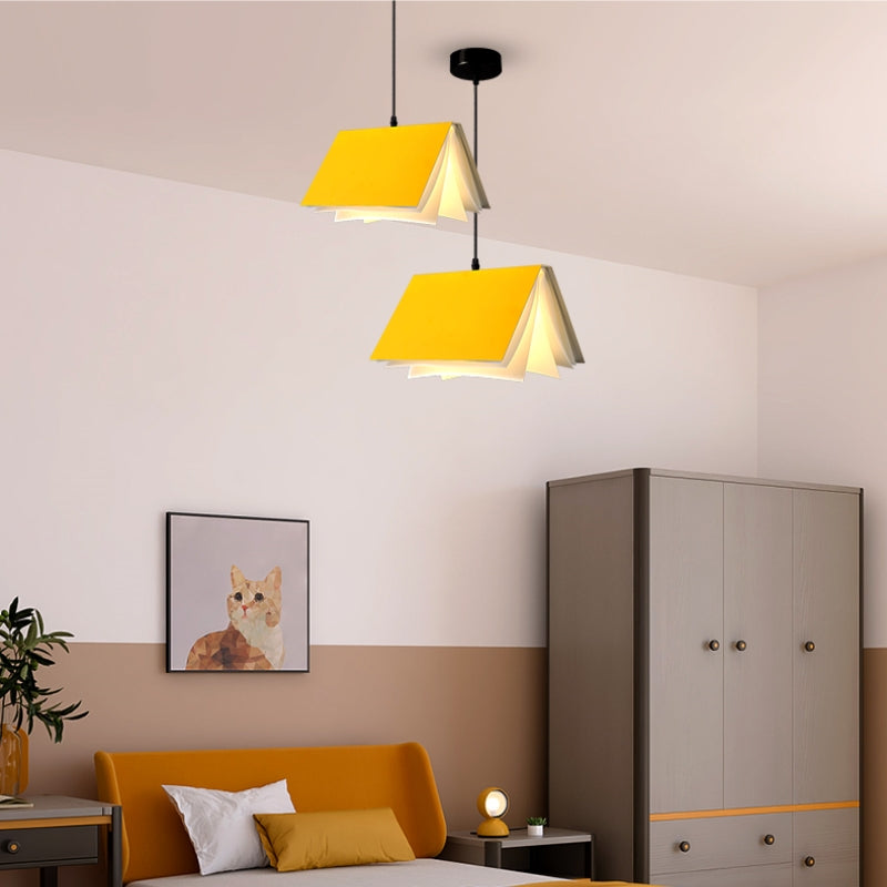 Yellow book pendants in a bedroom setting
