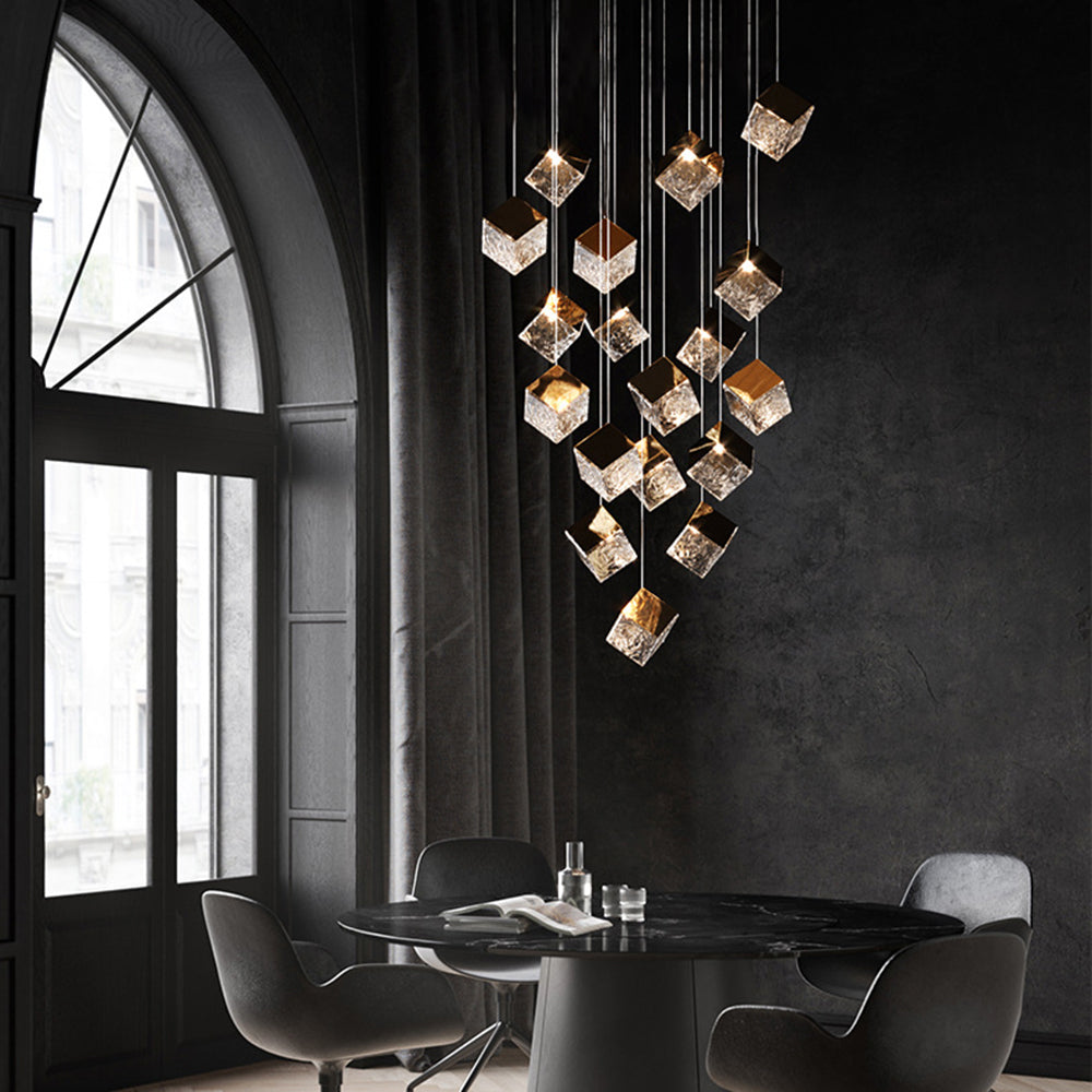 Long glass cube cluster over dark dining table