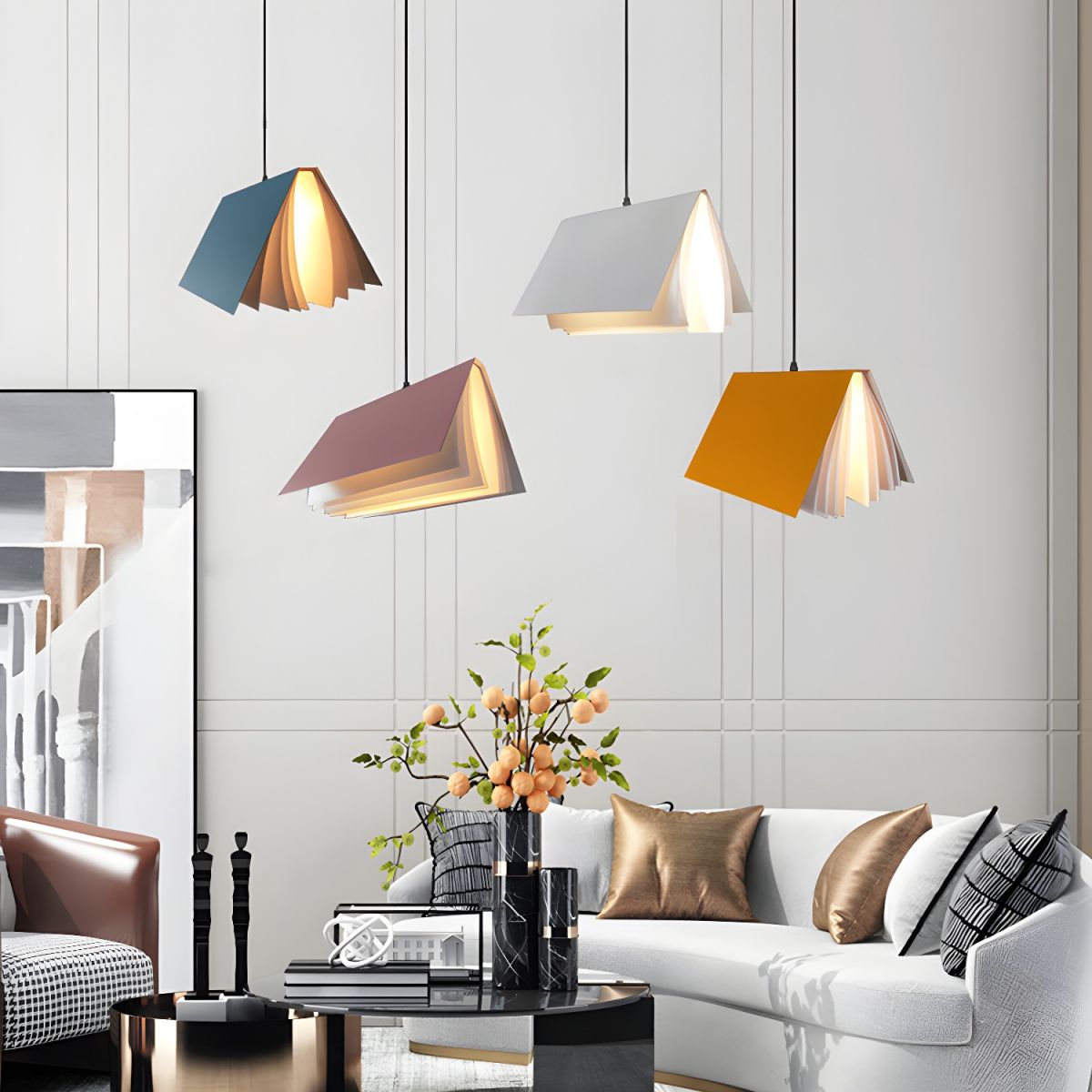 Four differently coloured book pendants above a sitting area