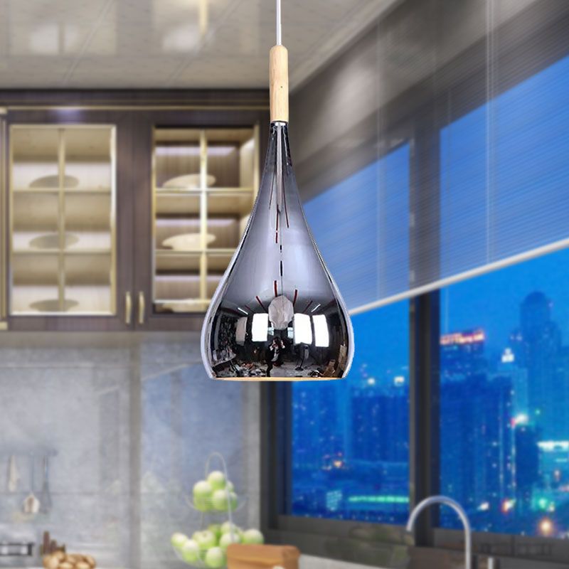 Avi Chrome teardrop pendant near a kitchen island and windows