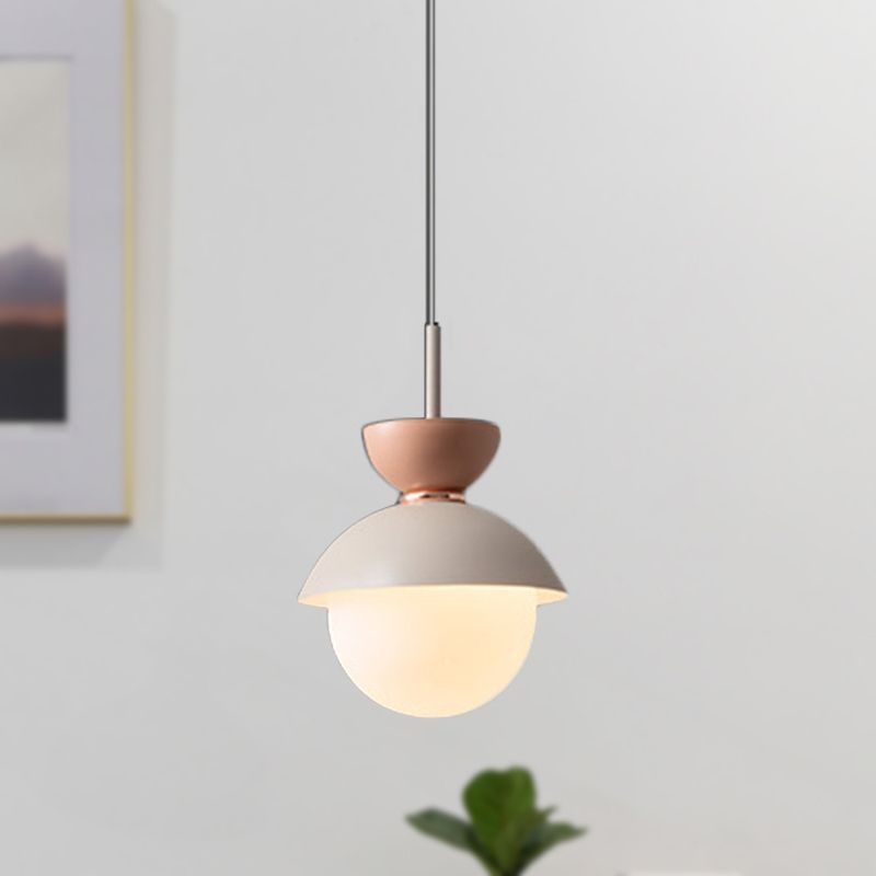 Morandi Gray pendant with pink upper cup and white globe near a window