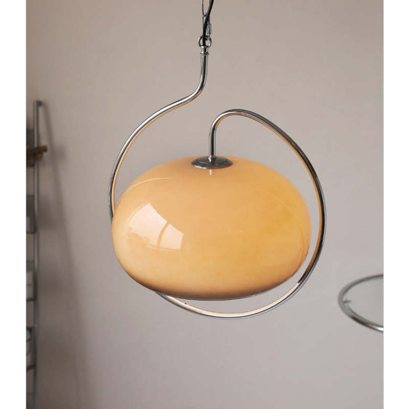 Hailie brown glass shade viewed from an angle beside a white wall.