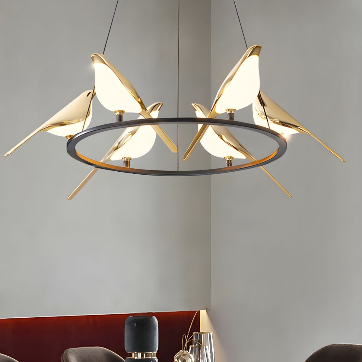 Six-bird pendant viewed from below showing gold-tone bird edges