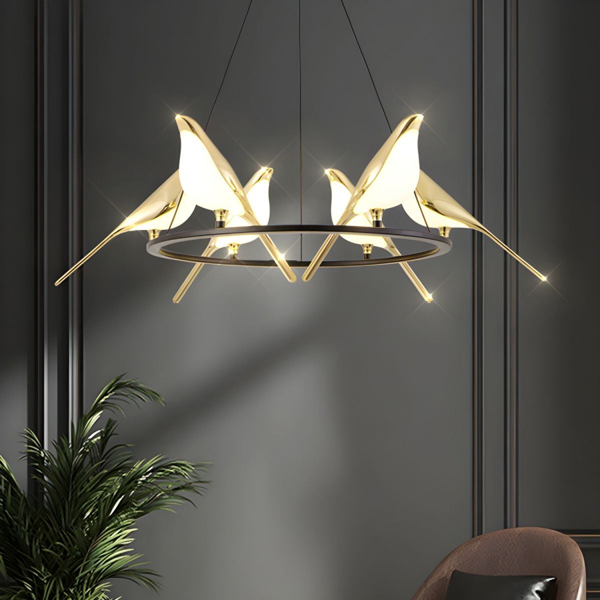 Close room view of glowing bird lights around ring