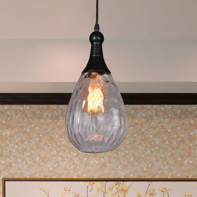 Avi Black-Clear textured glass pendant above wall art