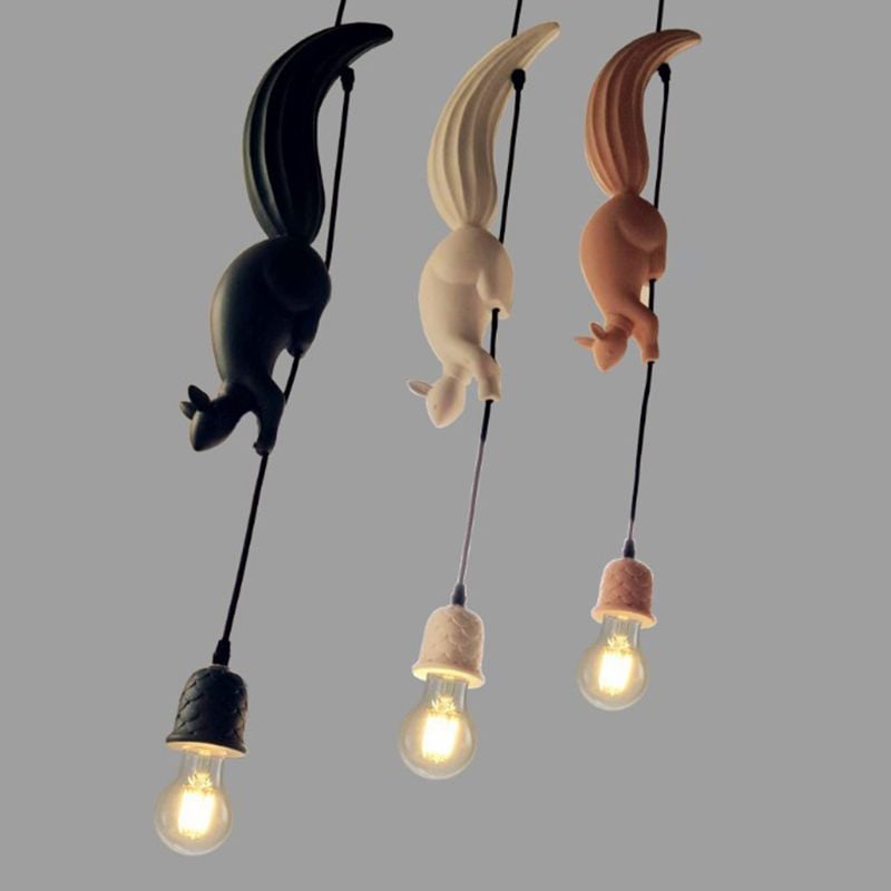 Black, white and pink squirrel pendants displayed together with pinecone-pattern holders and exposed round bulbs