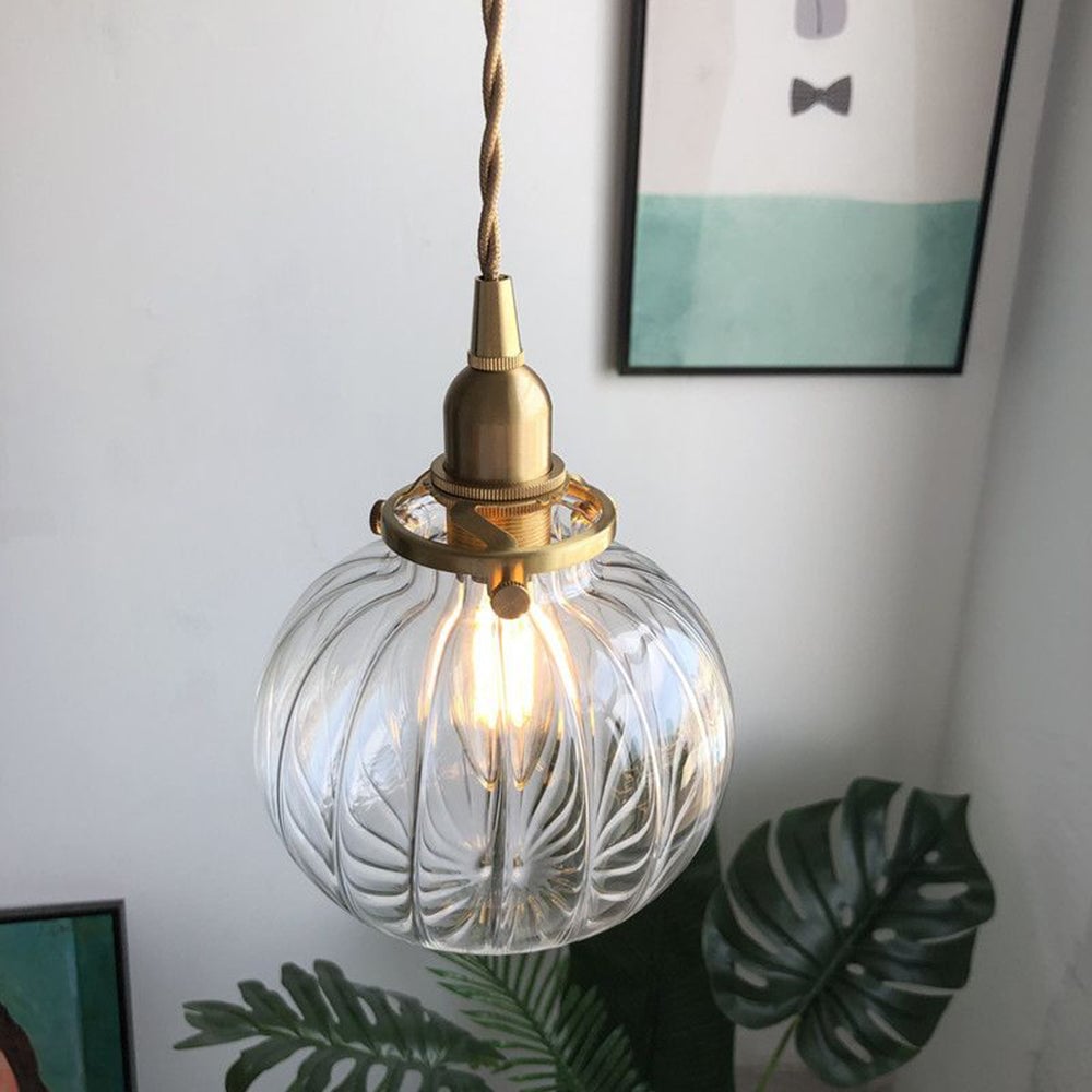 Clear ribbed oval glass pendant in living room