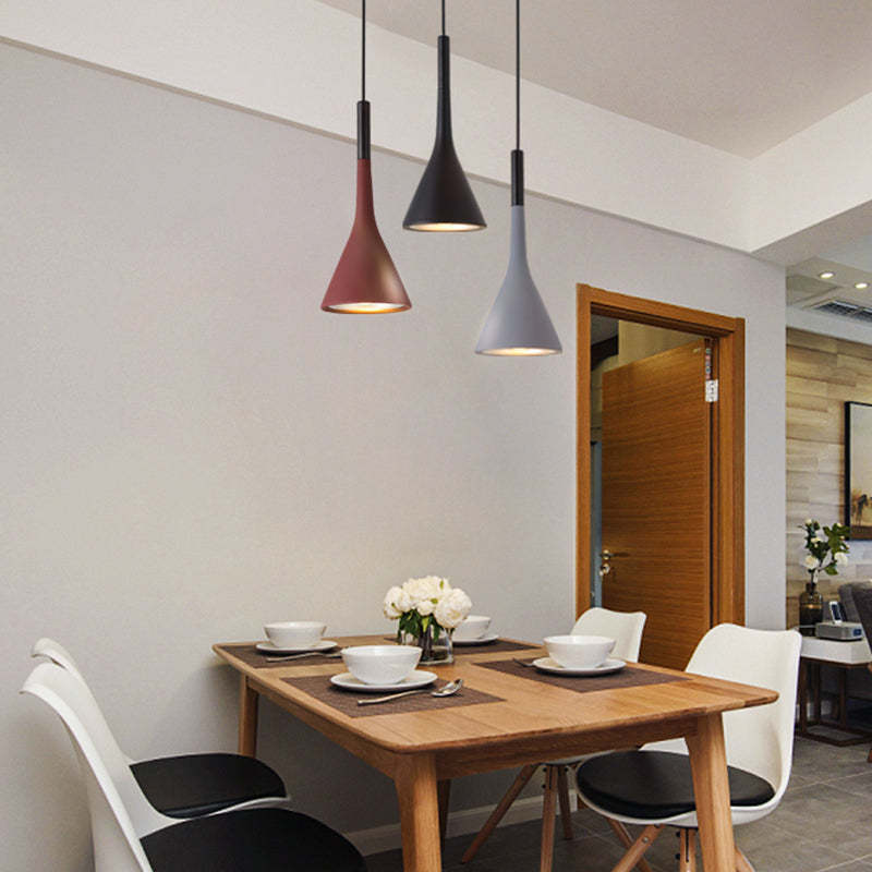 Red, black and gray pendants above dining table