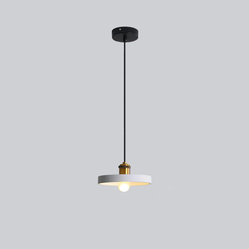 Light-coloured Morandi shallow-disc pendant on a black cord.