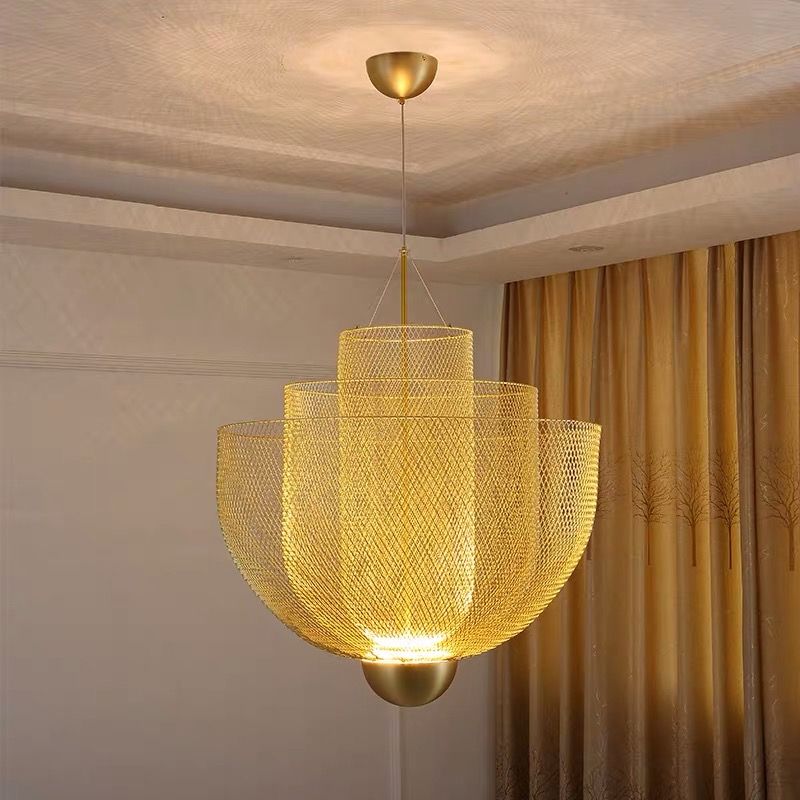 Gold layered mesh pendant lit in room