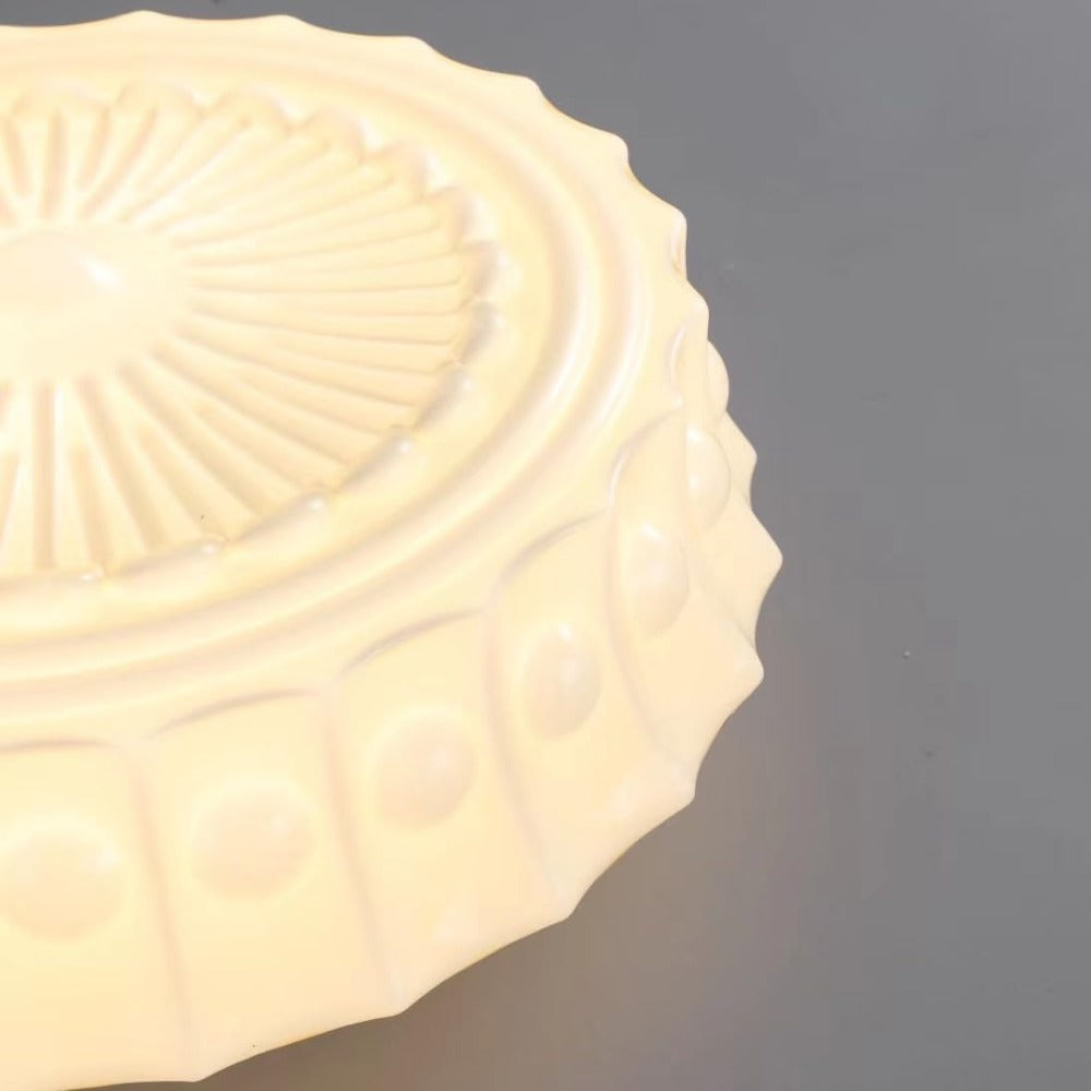 Warm close view of scalloped embossed glass rim