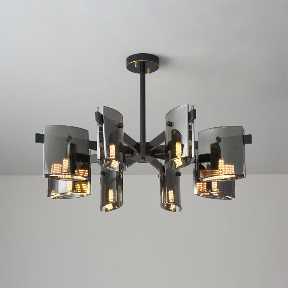 Black radial pendant with tall and broad curved glass panels, visible lit capsules, central hub, stem and canopy