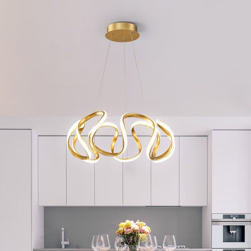 Golden six-head LED pendant above light dining setting