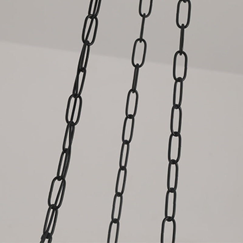 Three black pendant suspension chains close view