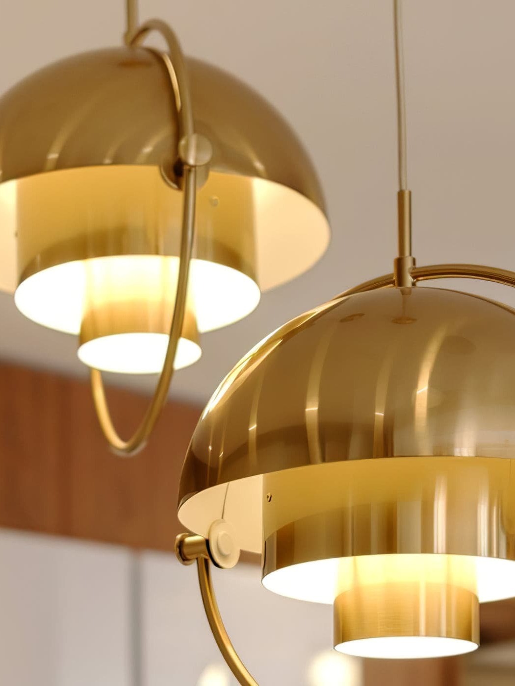 Illuminated copper-finish shade halves and inner tier details