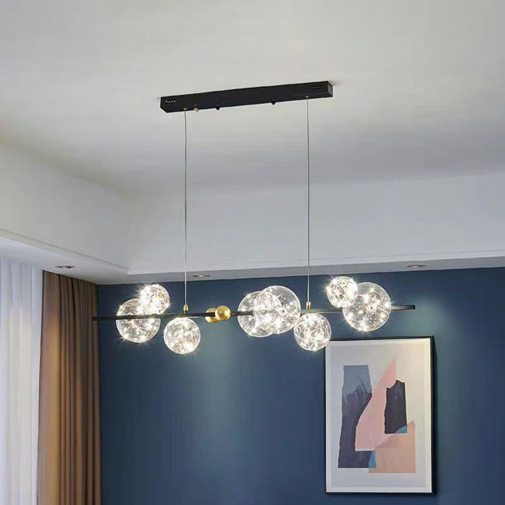 Black linear globe bar below rectangular ceiling canopy