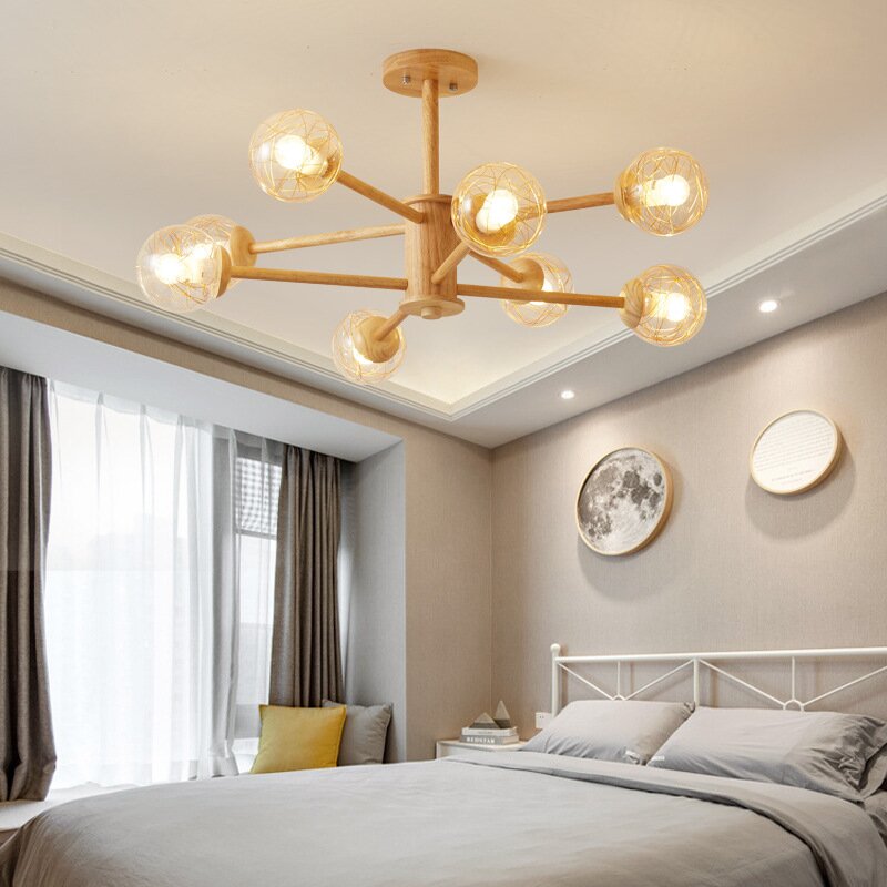 Ozawa 8Head wood and clear-glass pendant above a bedroom