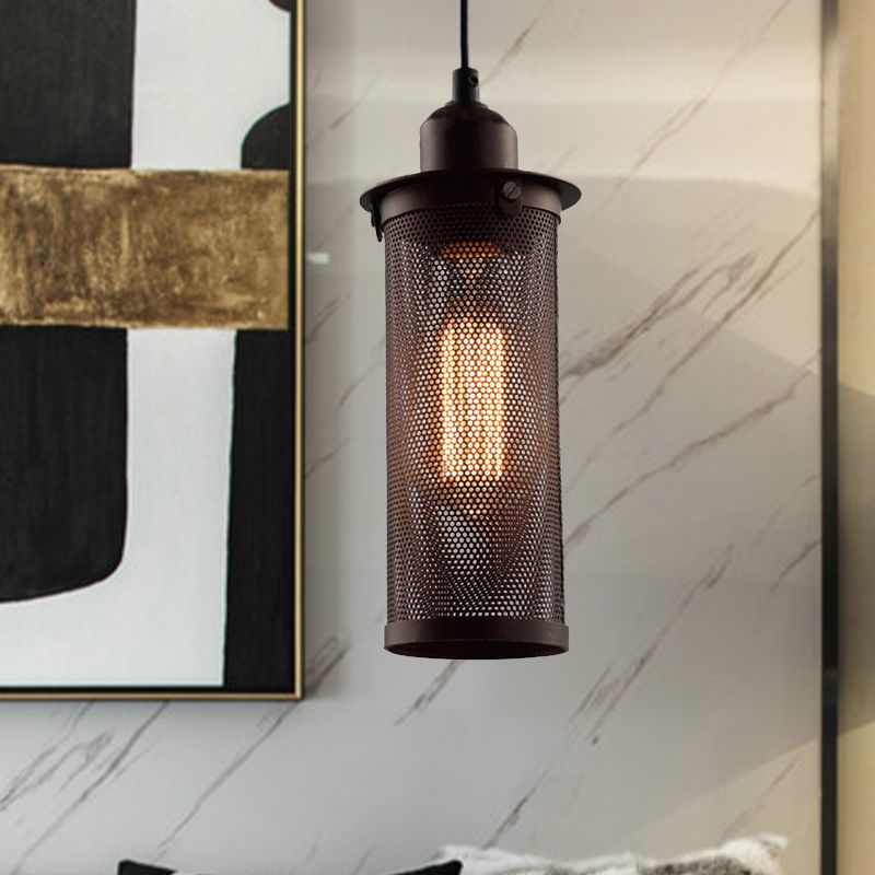 Rust Sanna pendant lit beside a framed mirror