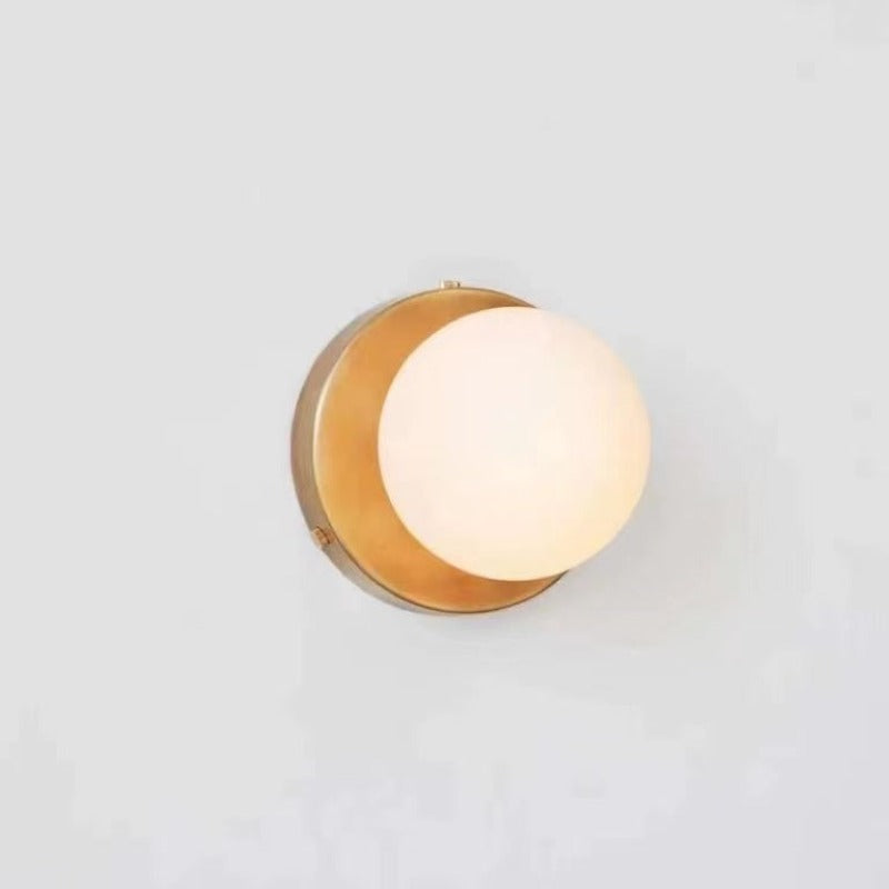 Yellow circular backplate with glowing white glass globe