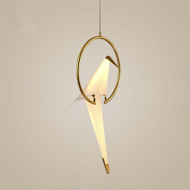 Single angular bird pendant perched inside an oval gold-coloured frame.